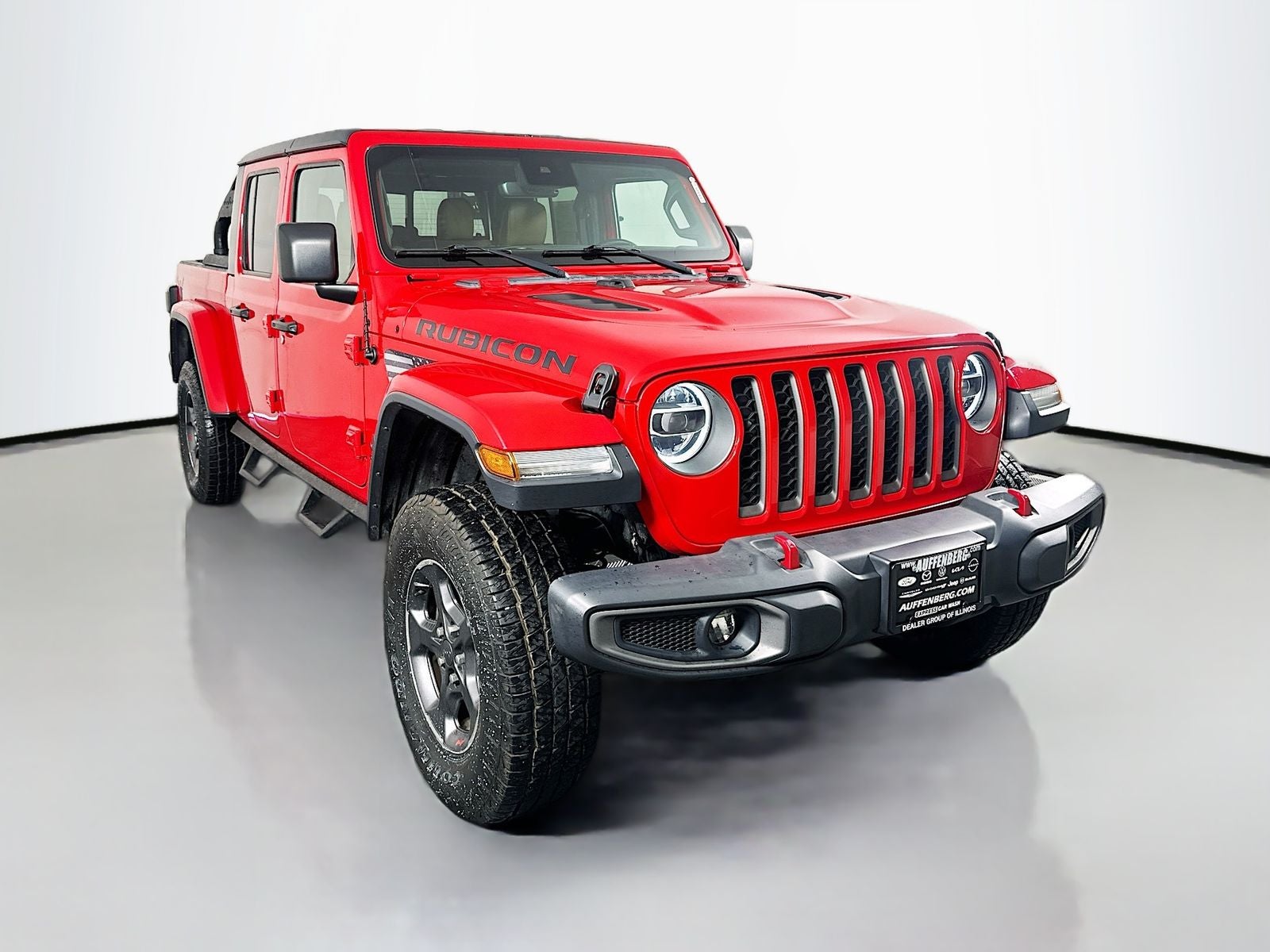 2020 Jeep Gladiator Rubicon 4x4 in Firecracker Red Clearcoat — front three-quarter view