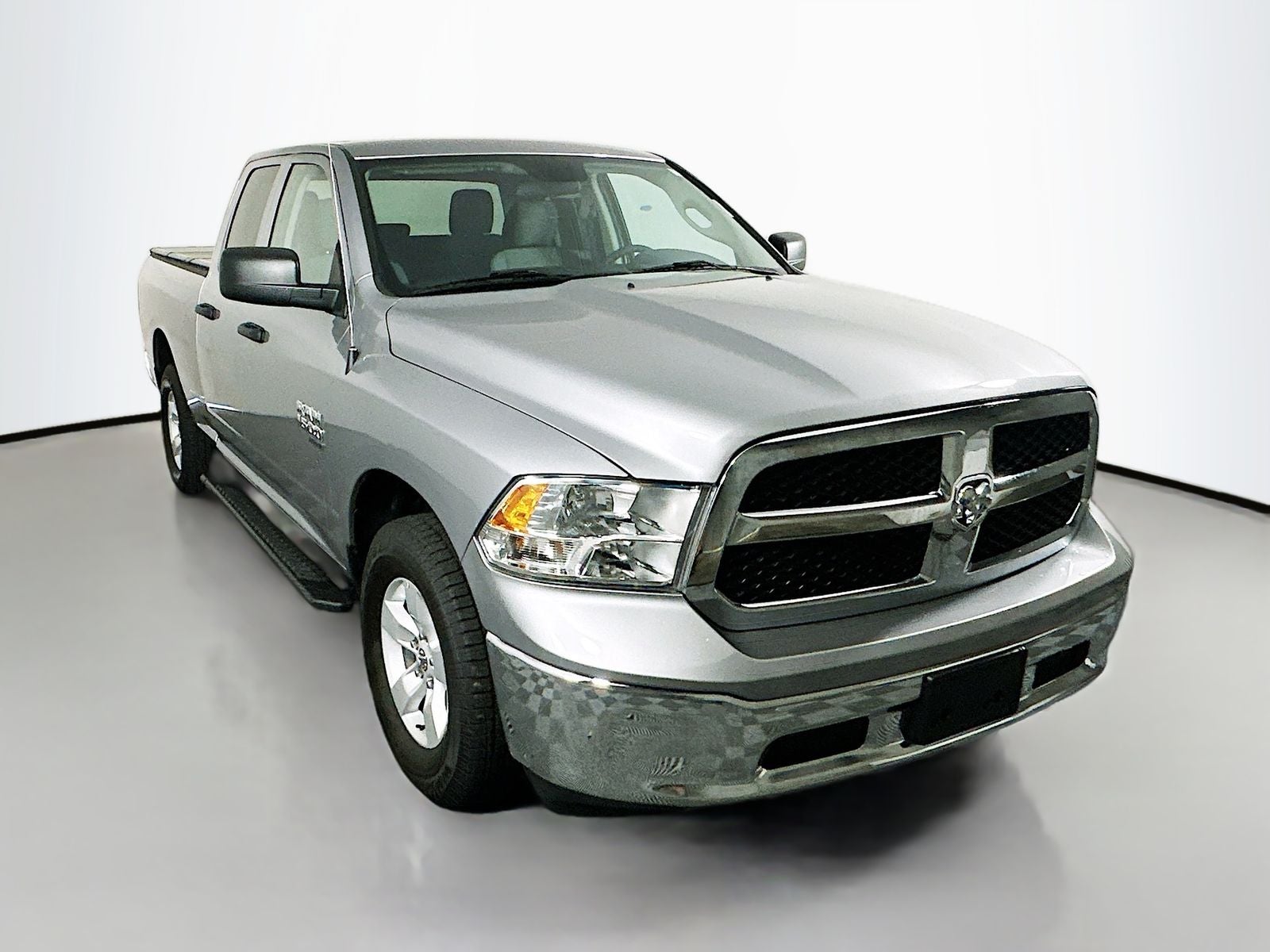 2024 RAM 1500 Classic SLT Quad Cab 4x4 6'4' Box in Billet Silver Metallic Clearcoat — front three-quarter view
