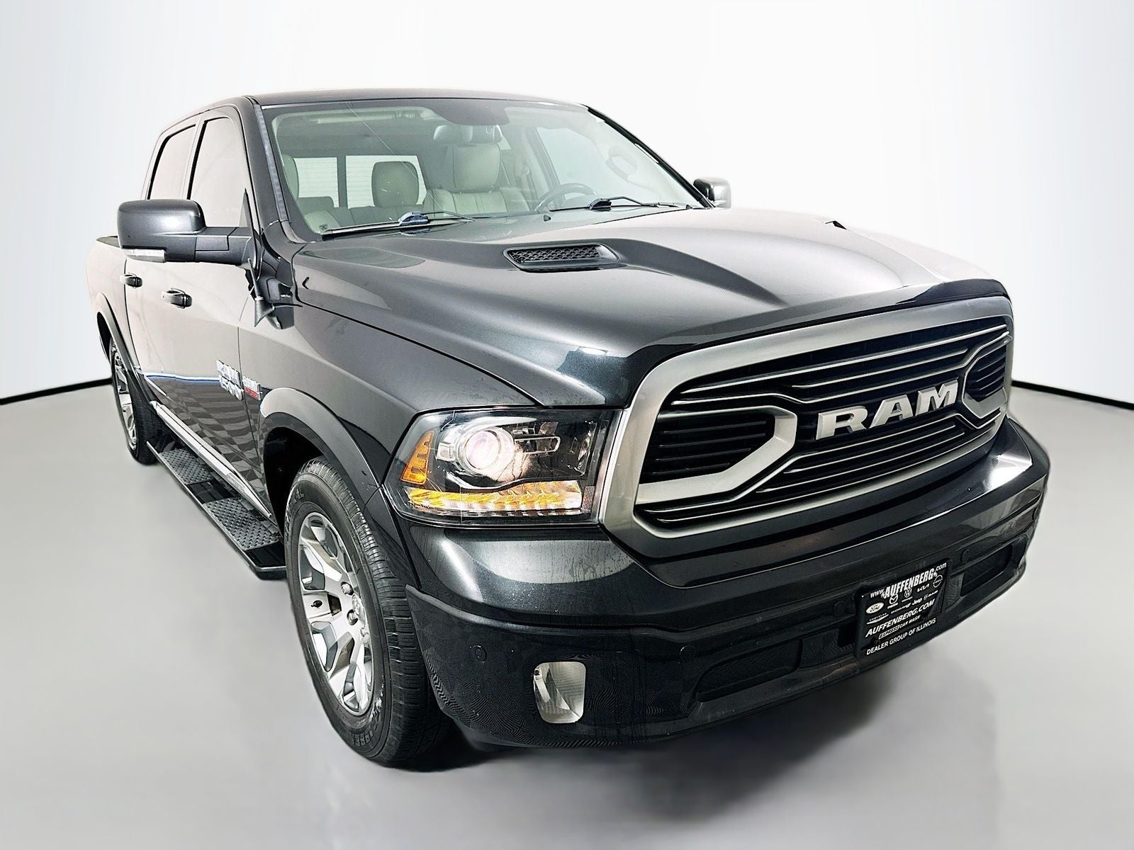 2018 RAM 1500 Limited Crew Cab 4x4 5'7' Box in Brilliant Black Crystal Pearlcoat — front three-quarter view