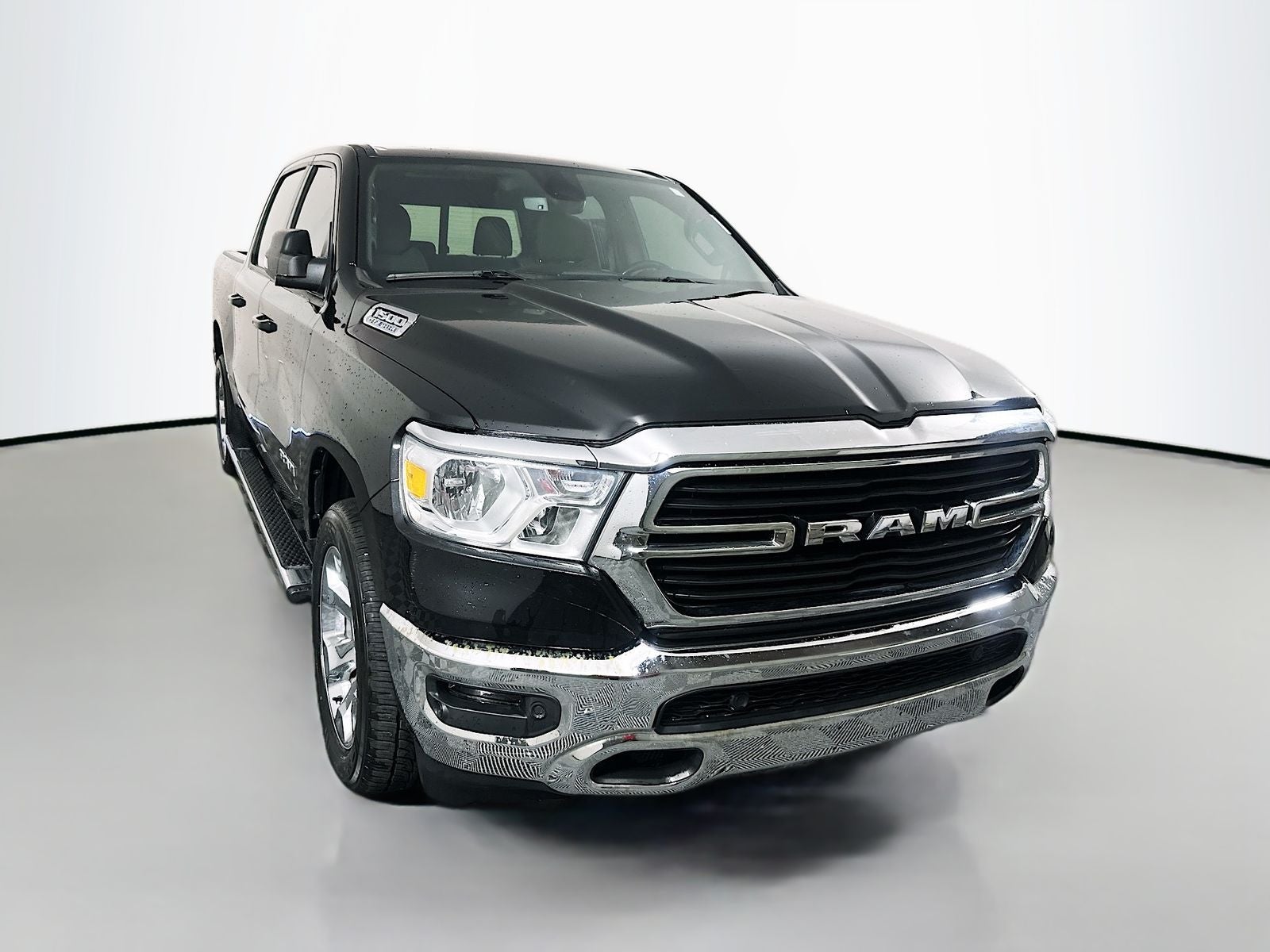 2021 RAM 1500 Big Horn Crew Cab 4x4 5'7' Box in Diamond Black Crystal Pearlcoat — front three-quarter view