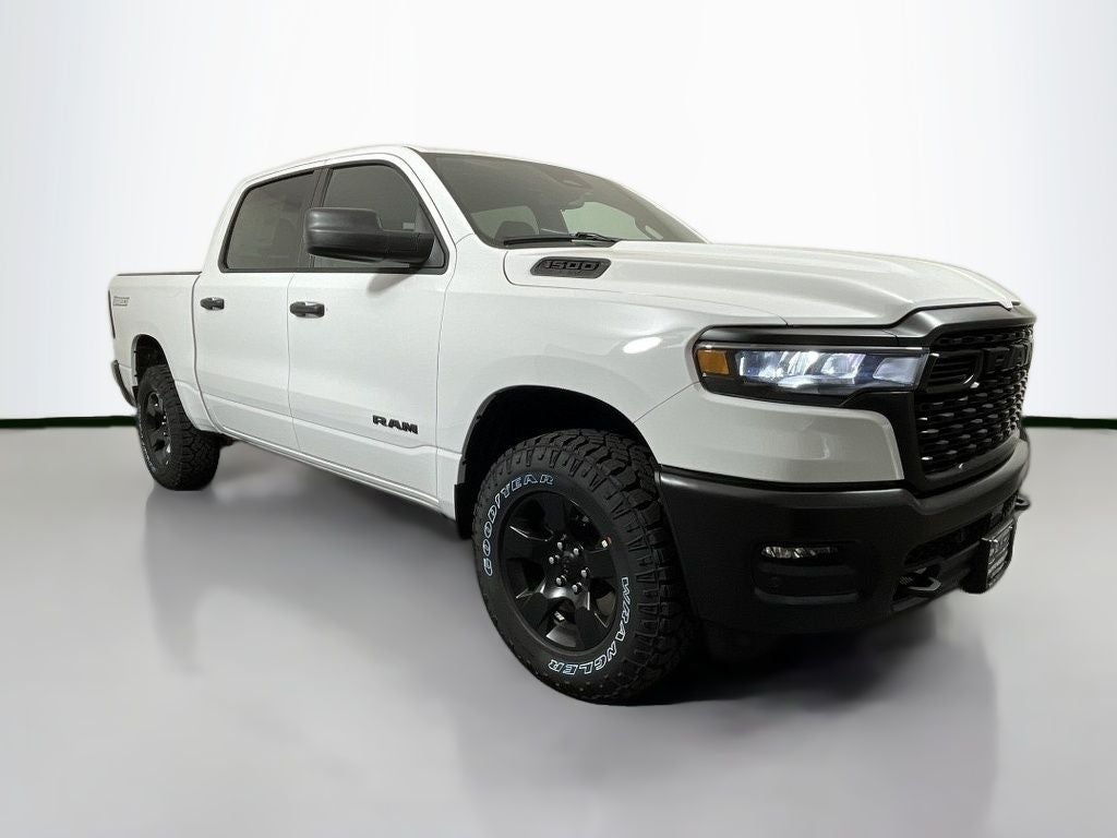 2025 RAM 1500 Warlock Crew Cab 4x4 5'7' Box in Bright White Clearcoat — front three-quarter view