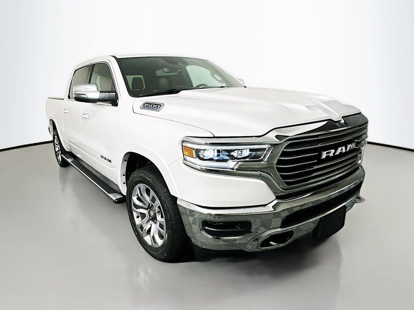2023 RAM 1500 Limited Longhorn Crew Cab 4x4 5'7' Box in Ivory White Tri-Coat Pearlcoat — front three-quarter view