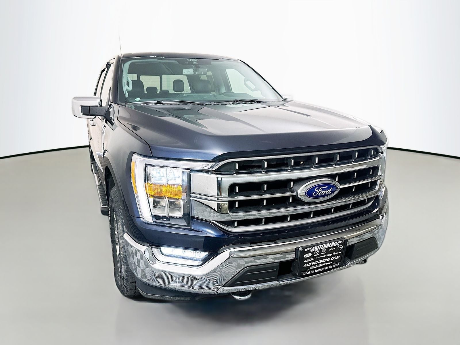 2021 Ford F-150 LARIAT in Antimatter Blue Metallic — front three-quarter view