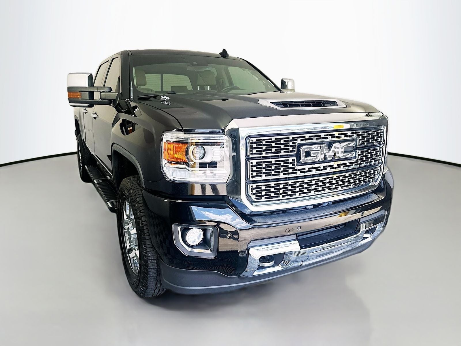 2019 GMC Sierra 2500HD Denali in Onyx Black — front three-quarter view