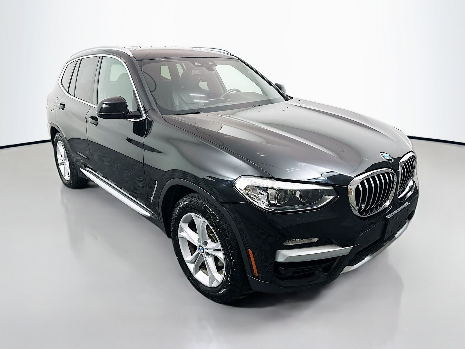 2019 BMW X3 xDrive30i in Jet Black — front three-quarter view