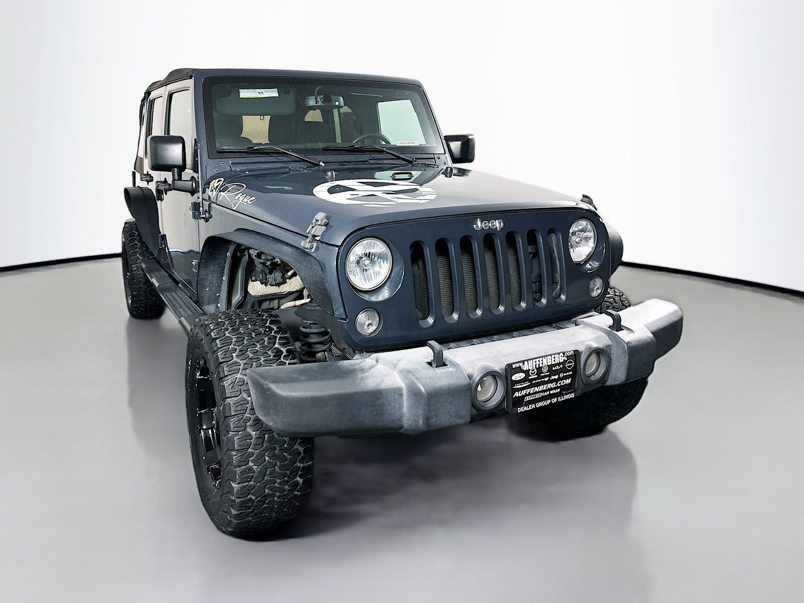 2017 Jeep Wrangler Unlimited Sport in Rhino Clearcoat — front three-quarter view