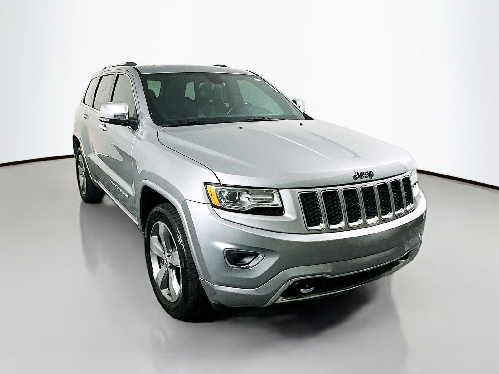 2015 Jeep Grand Cherokee Overland in Billet Silver Metallic Clearcoat — front three-quarter view