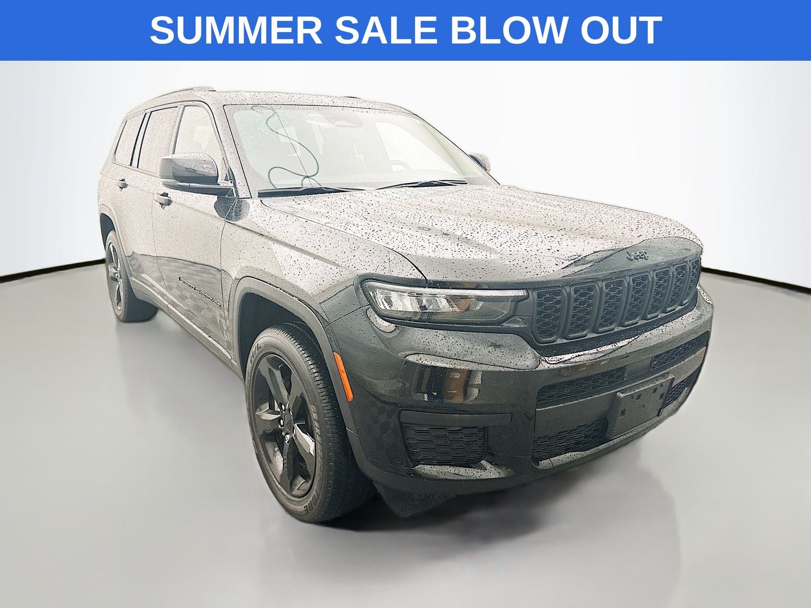 2023 Jeep Grand Cherokee L Altitude in Diamond Black Crystal Pearlcoat — front three-quarter view