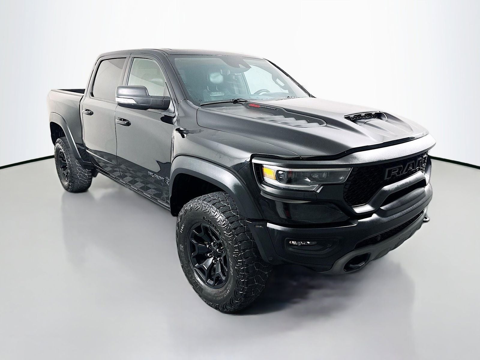 2021 RAM 1500 TRX in Diamond Black Crystal Pearlcoat — front three-quarter view