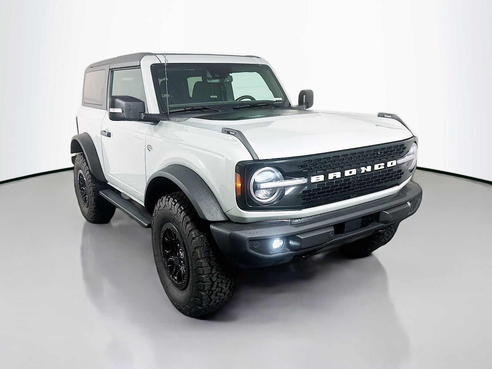 2022 Ford Bronco Wildtrak in Cactus Gray — front three-quarter view
