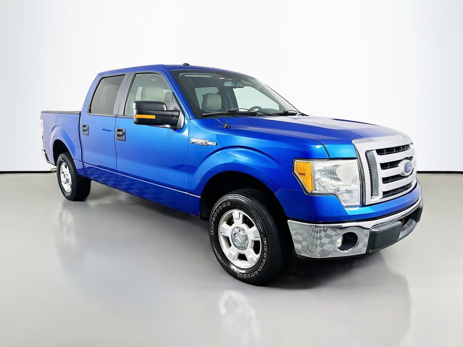 2010 Ford F-150 XLT in Blue — front three-quarter view