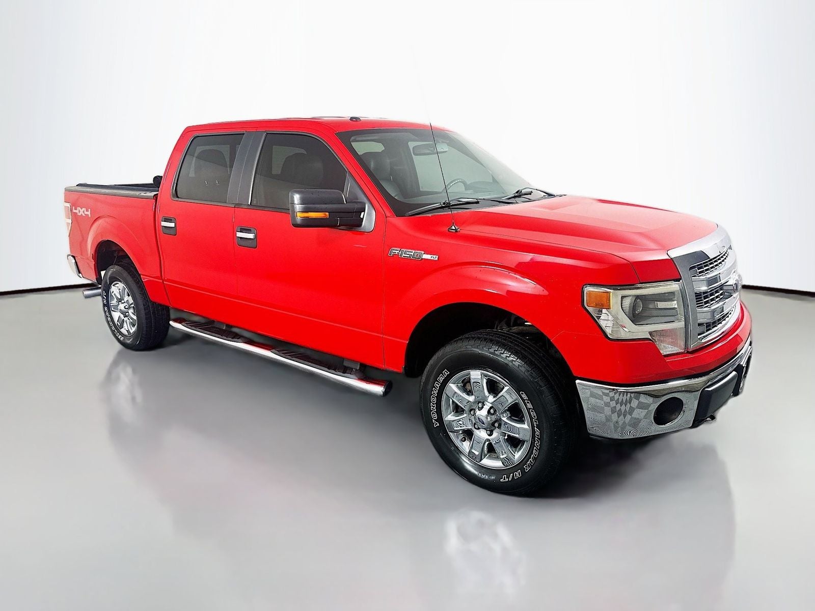 2014 Ford F-150 XLT in Race Red — front three-quarter view