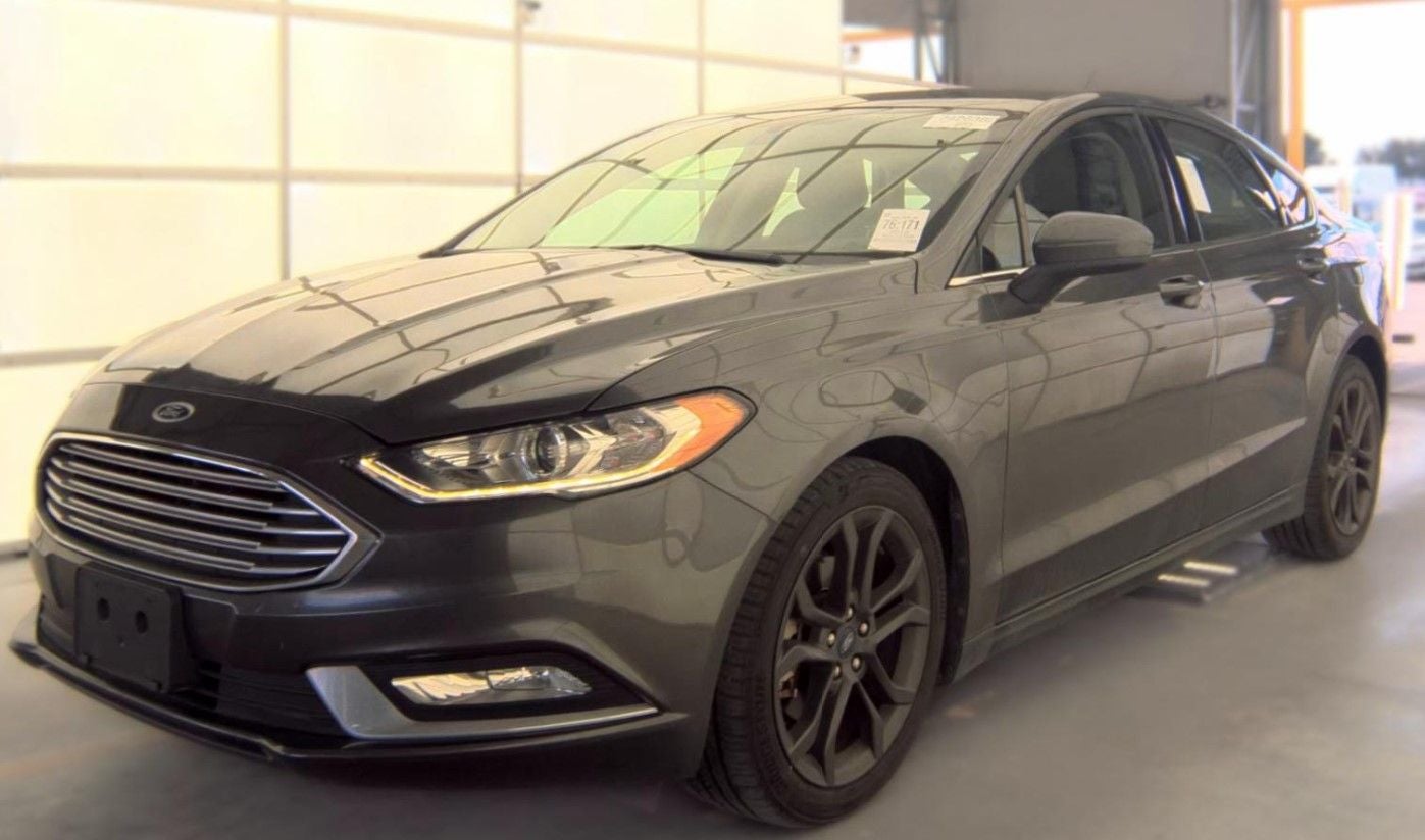 2018 Ford Fusion SE in Magnetic Metallic — front three-quarter view