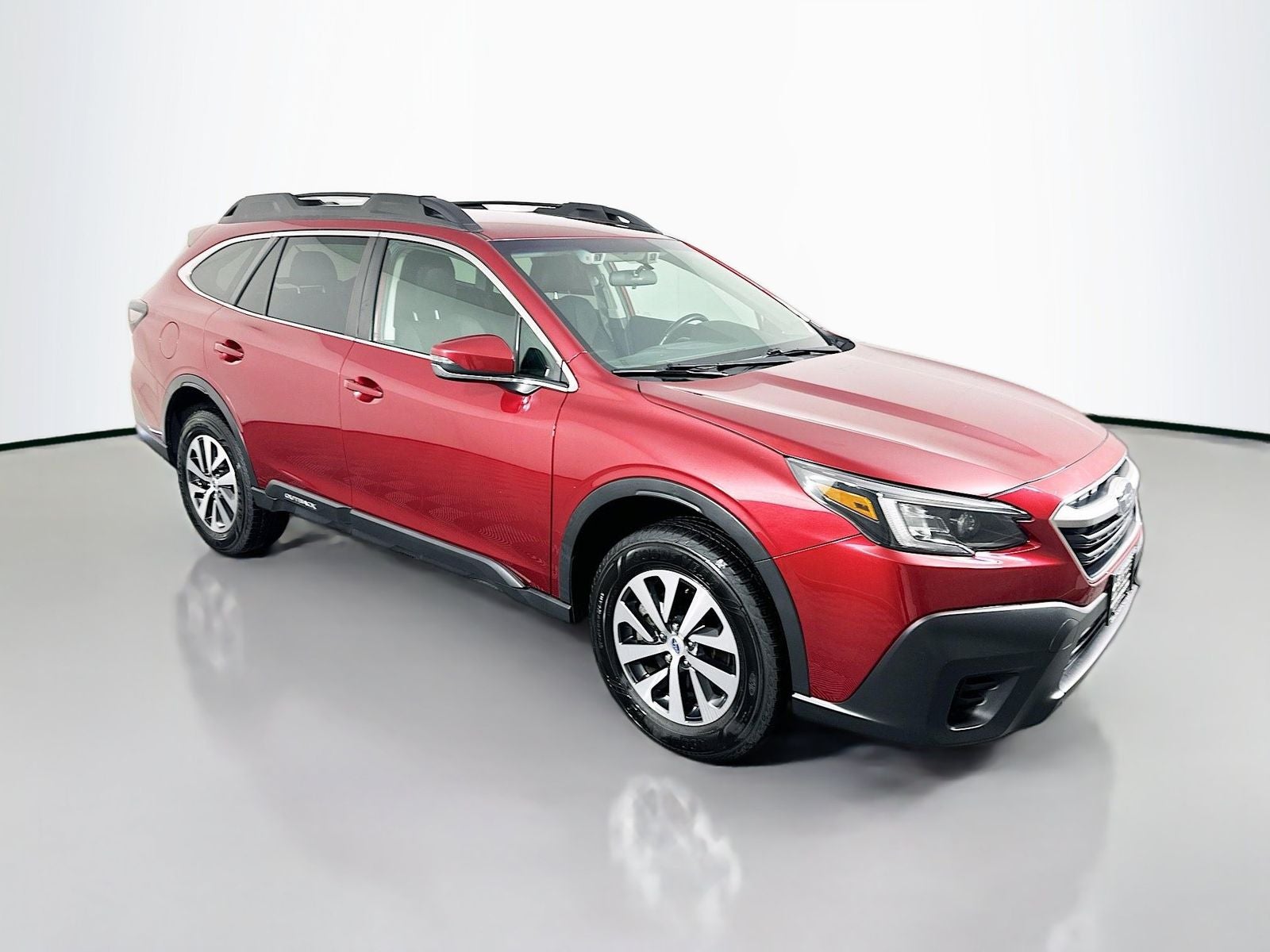 2022 Subaru Outback Premium in Crimson Red Pearl — front three-quarter view