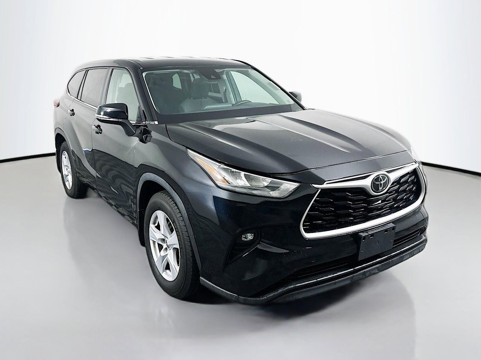 2020 Toyota Highlander LE in Midnight Black Metallic — front three-quarter view