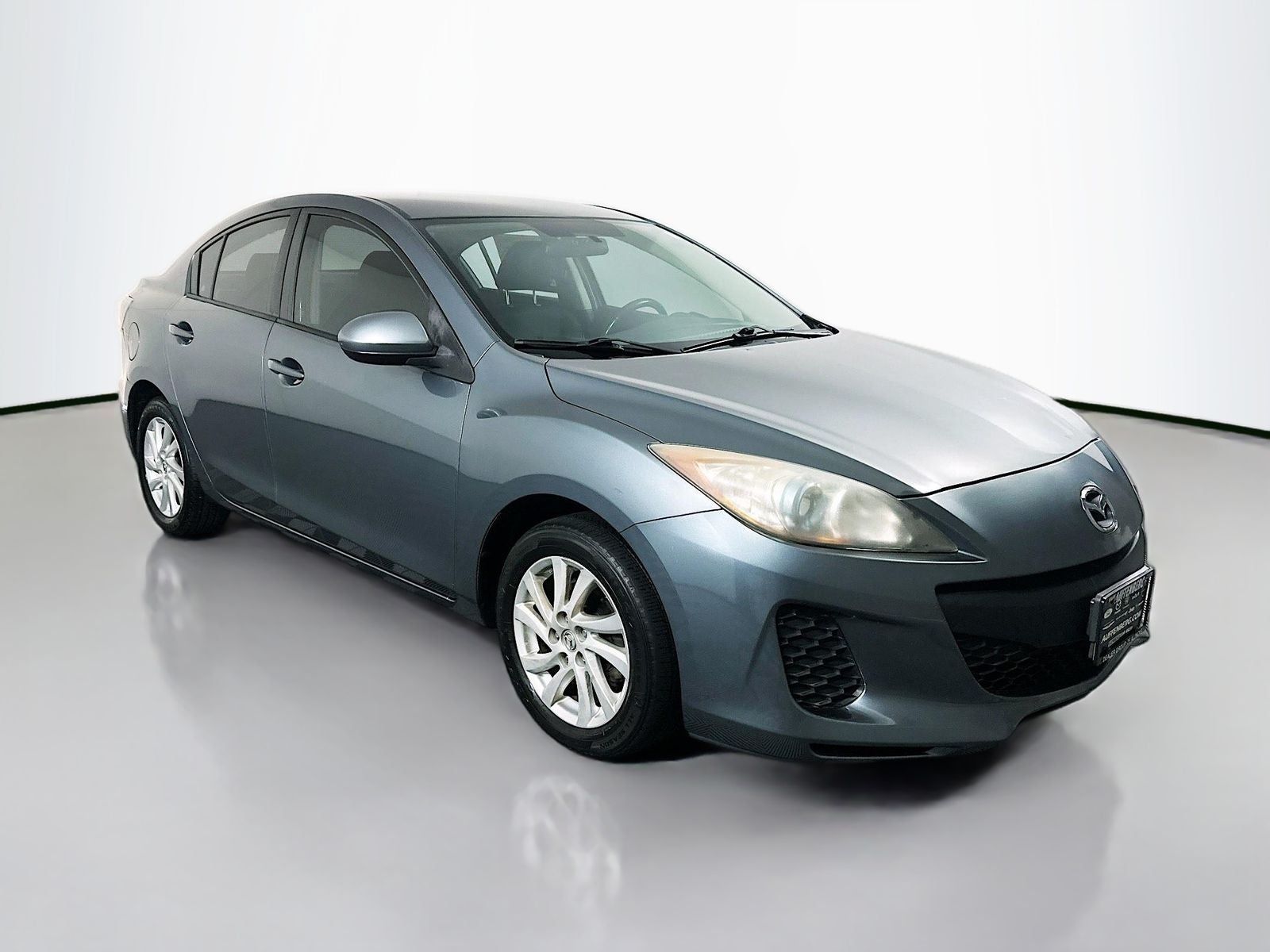2012 Mazda Mazda3 i Touring in Dolphin Gray Mica — front three-quarter view
