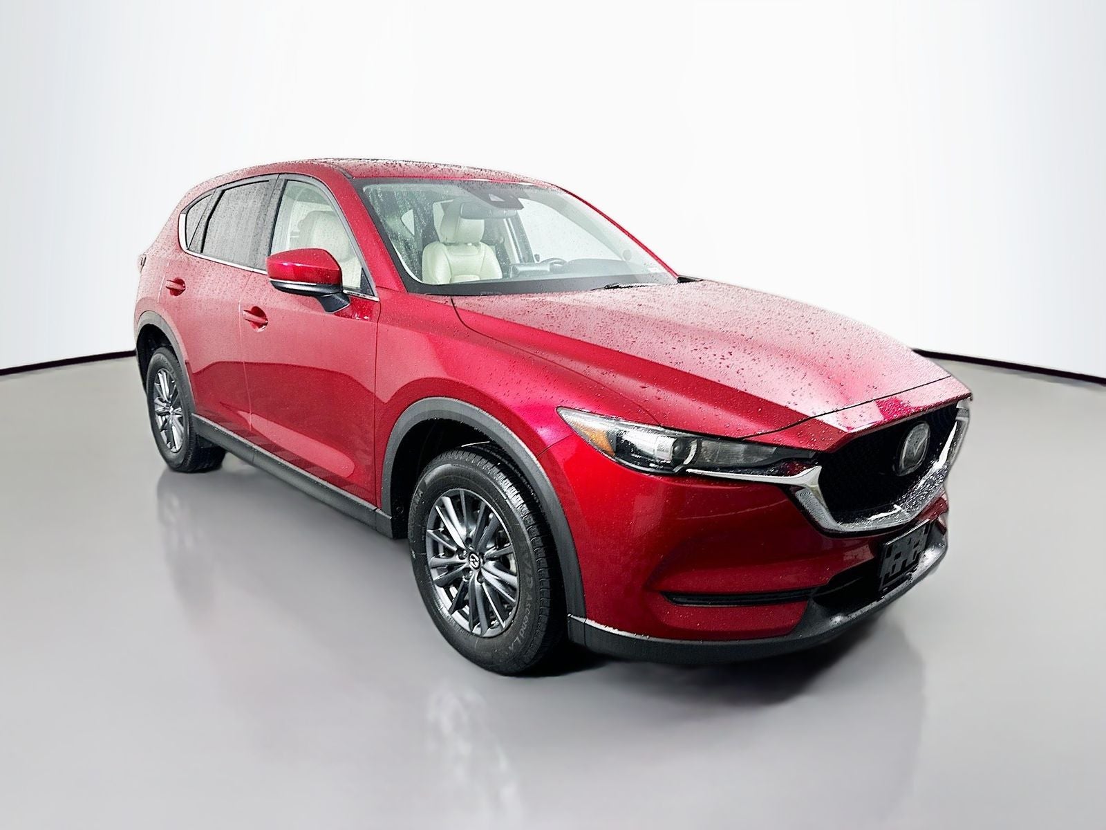 2020 Mazda Mazda CX-5 Touring in Soul Red Crystal Metallic — front three-quarter view