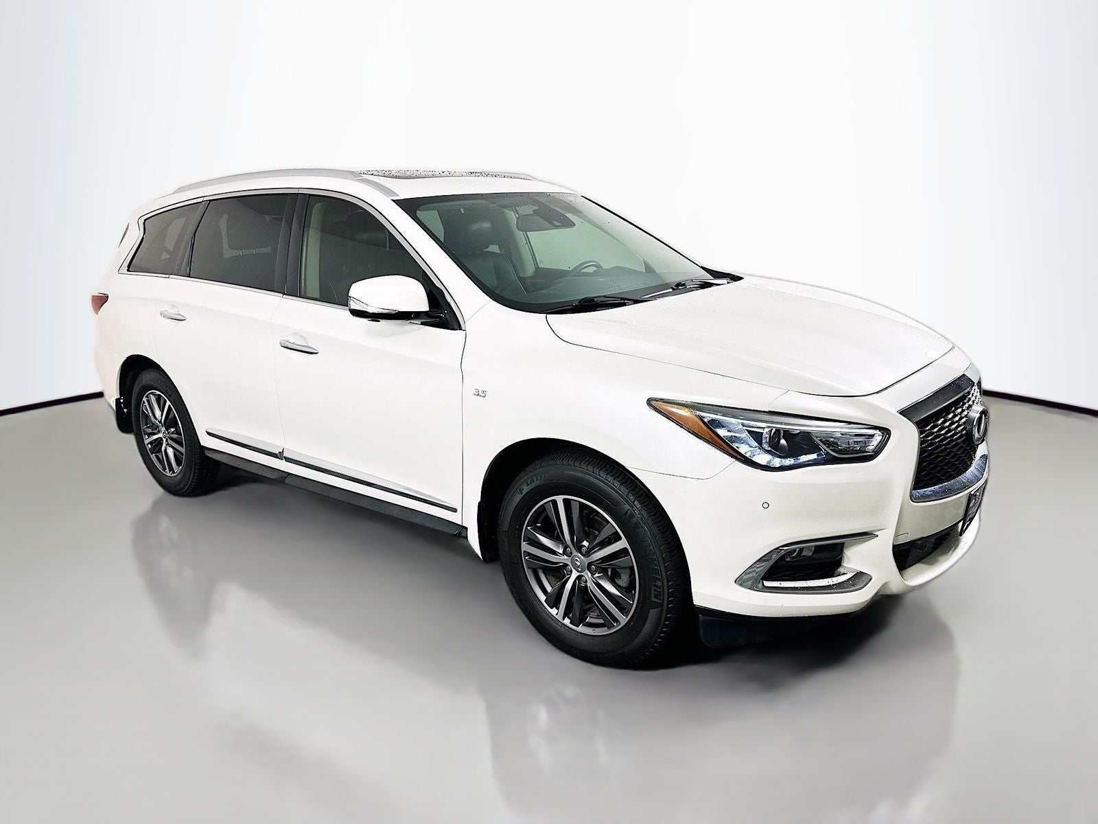 2019 INFINITI QX60 LUXE in Majestic White — front three-quarter view