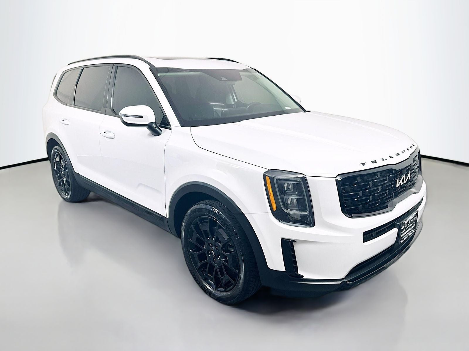 2022 Kia Telluride EX in Glacial White Pearl — front three-quarter view