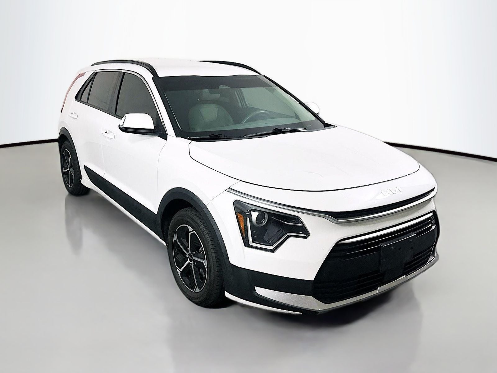 2023 Kia Niro EX in Snow White Pearl — front three-quarter view