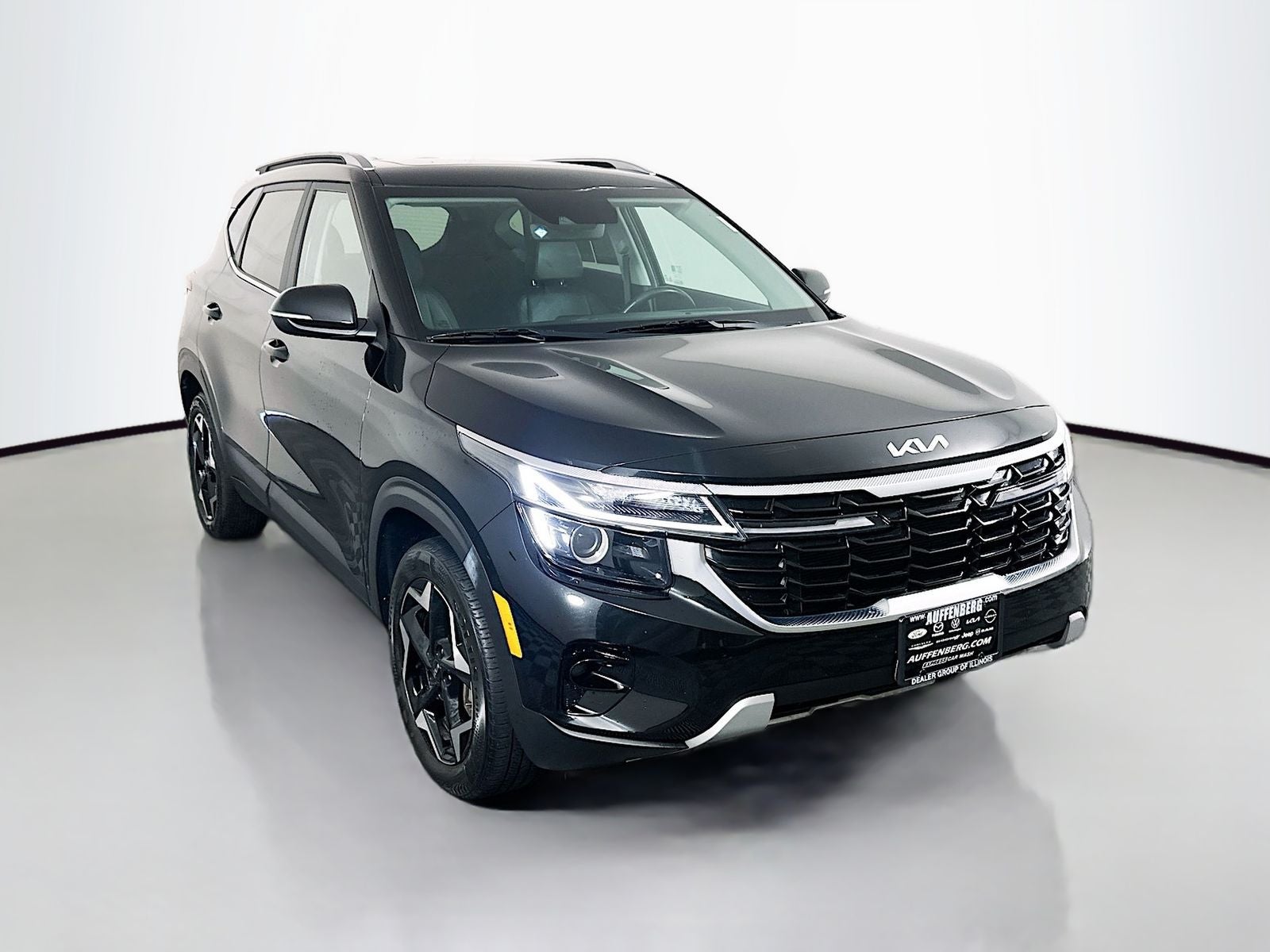 2024 Kia Seltos EX in Fusion Black — front three-quarter view