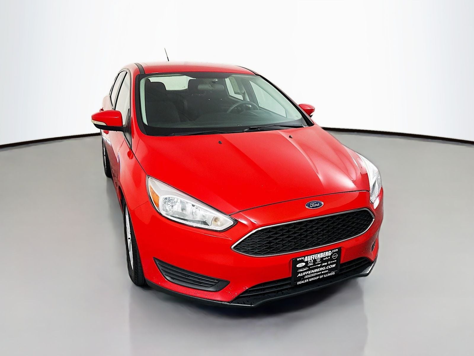 2017 Ford Focus SE in Race Red — front three-quarter view