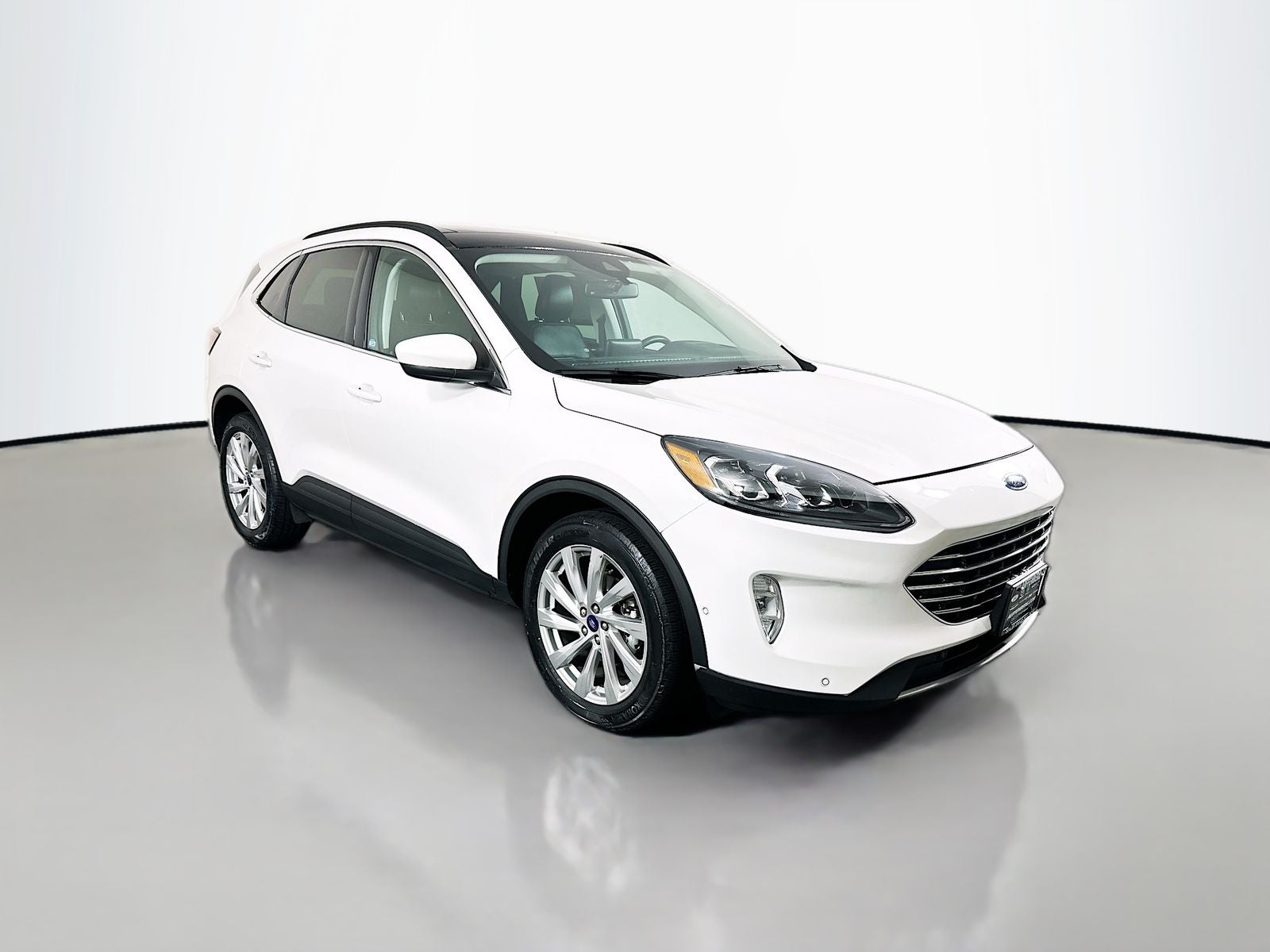 2021 Ford Escape Titanium Hybrid in Star White Metallic Tri-Coat — front three-quarter view