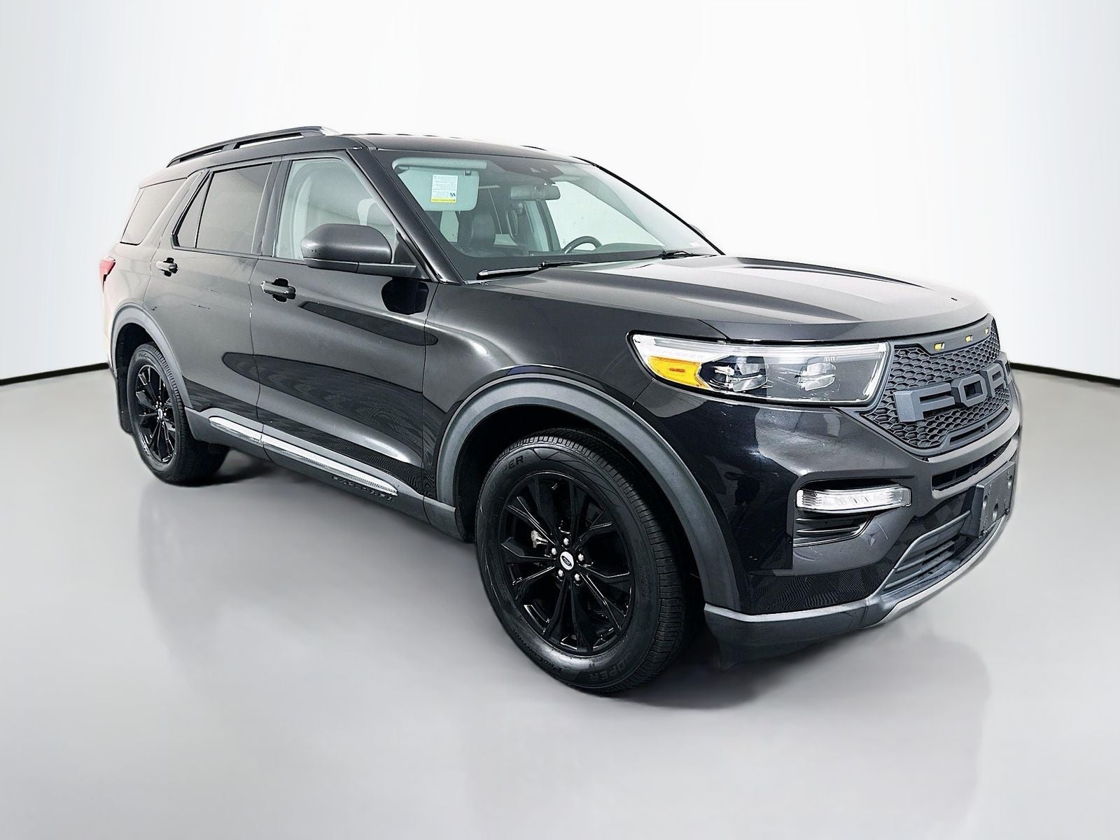 2021 Ford Explorer XLT in Black Metallic — front three-quarter view