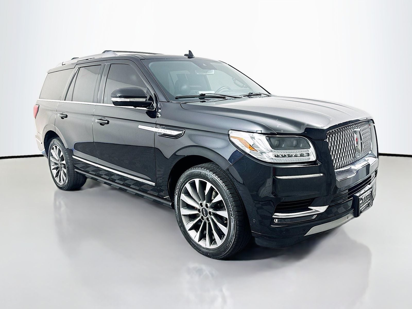 2021 Lincoln Navigator Reserve in Black — front three-quarter view