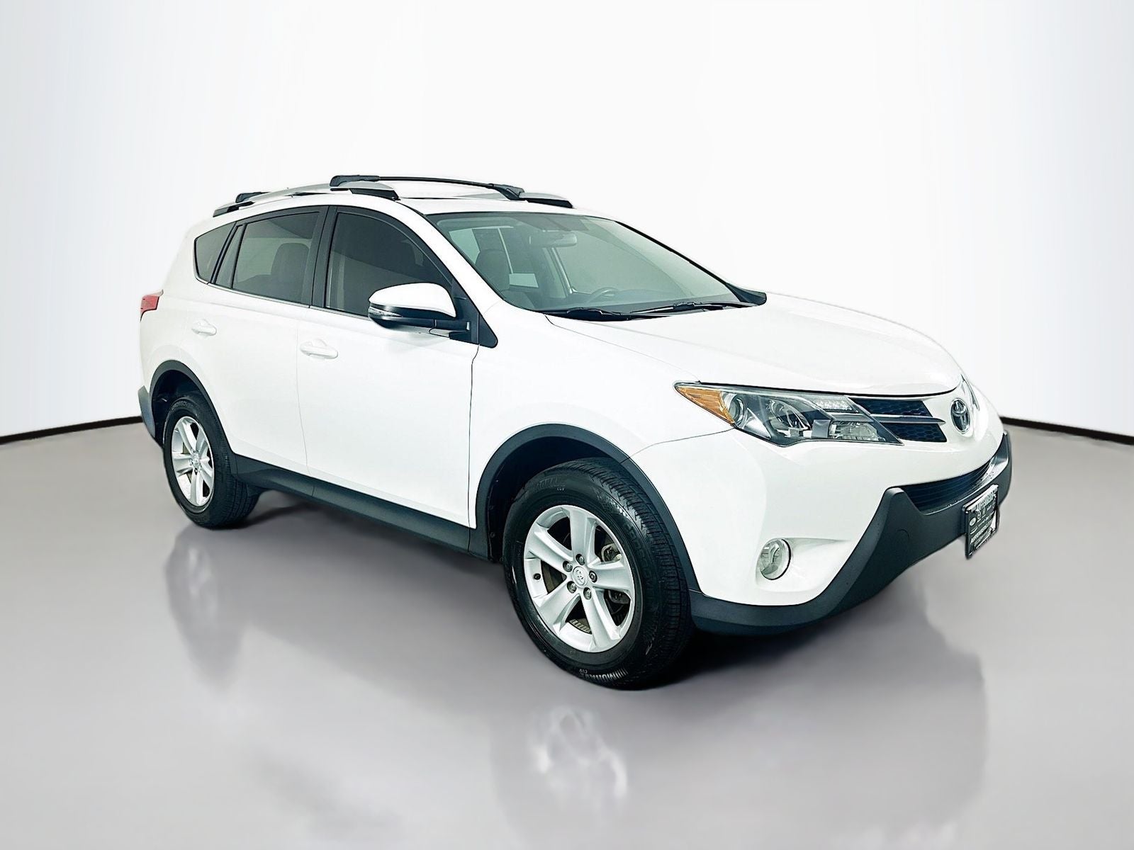 2014 Toyota RAV4 XLE in Super White — front three-quarter view