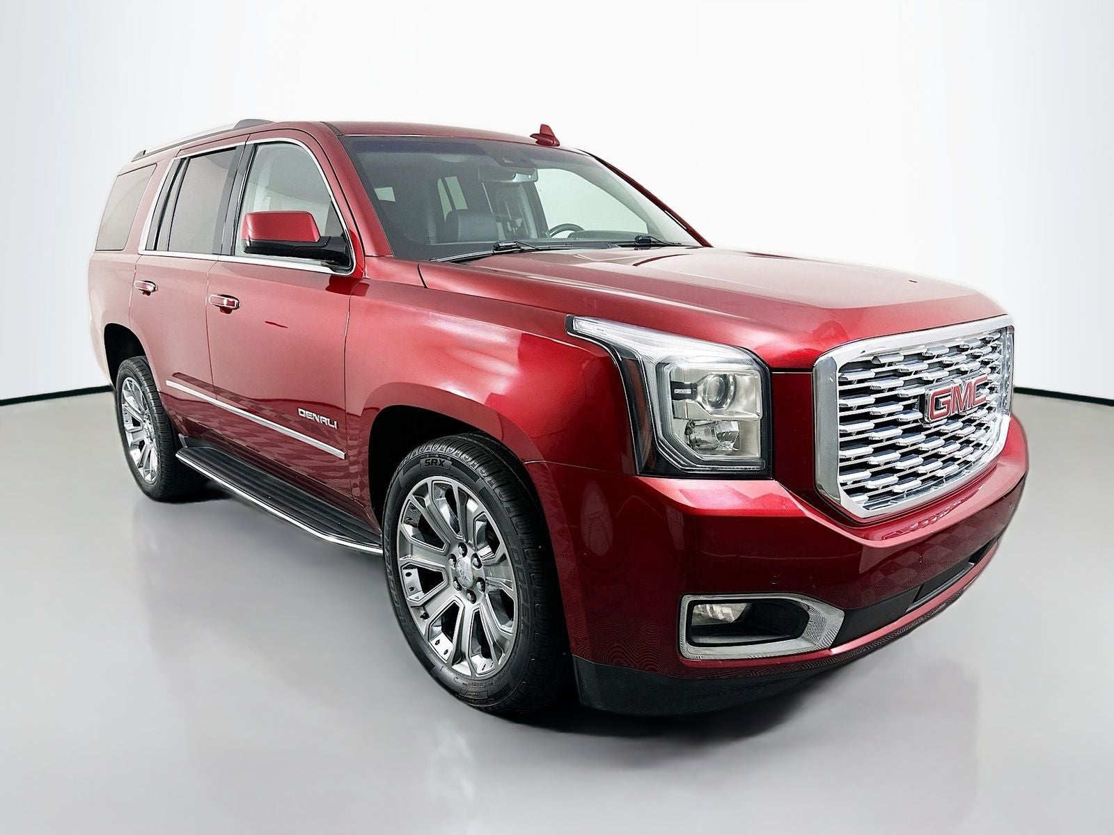 2018 GMC Yukon Denali in Crimson Red Tintcoat — front three-quarter view