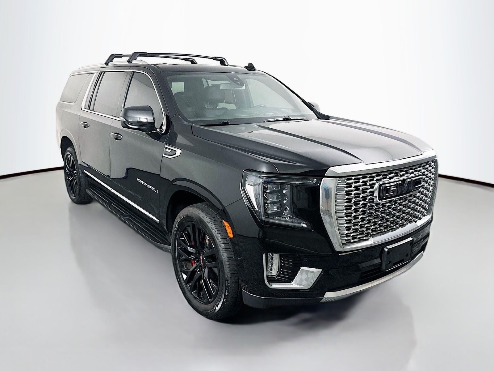 2021 GMC Yukon XL Denali in Onyx Black — front three-quarter view