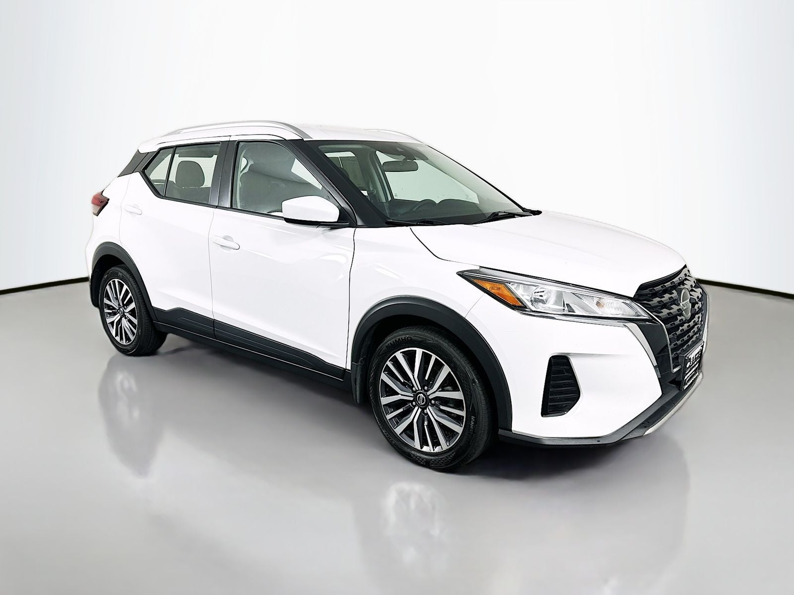 2021 Nissan Kicks SV in Fresh Powder — front three-quarter view