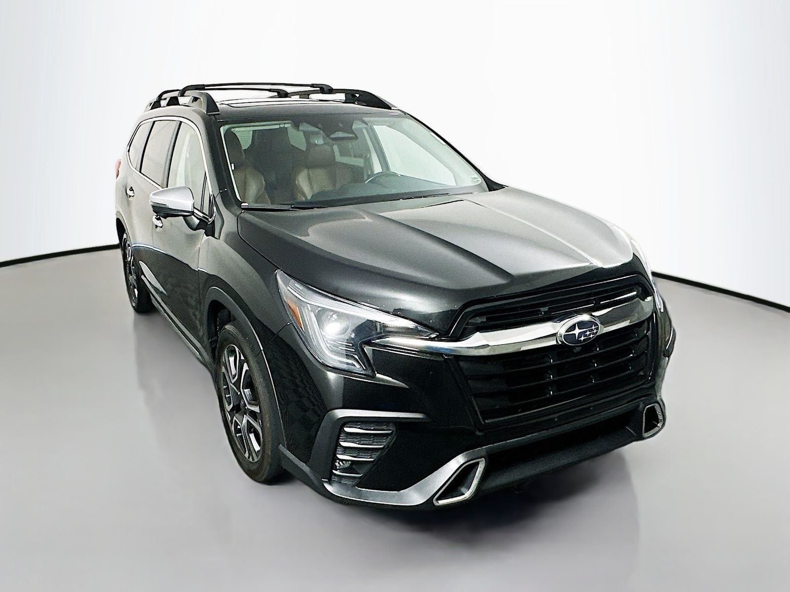 2023 Subaru Ascent Touring in Crystal Black Silica — front three-quarter view