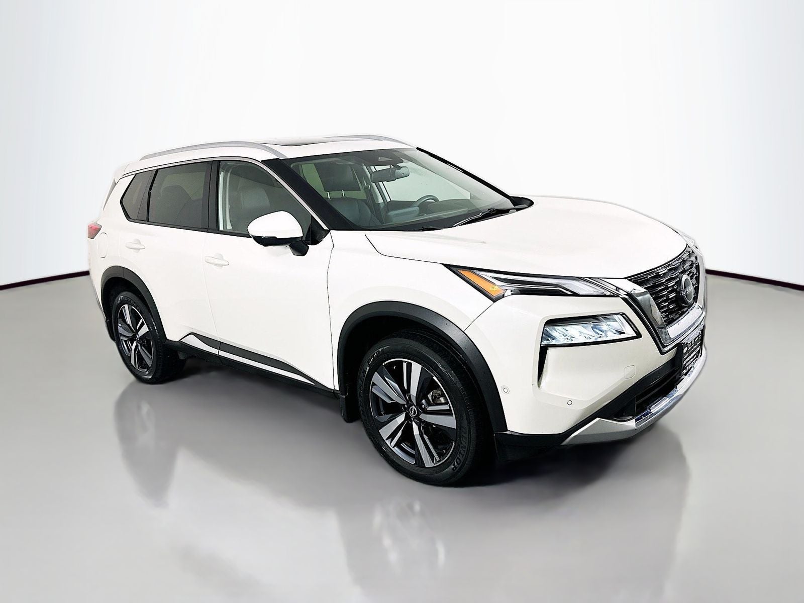 2023 Nissan Rogue Platinum in Pearl White Tricoat — front three-quarter view